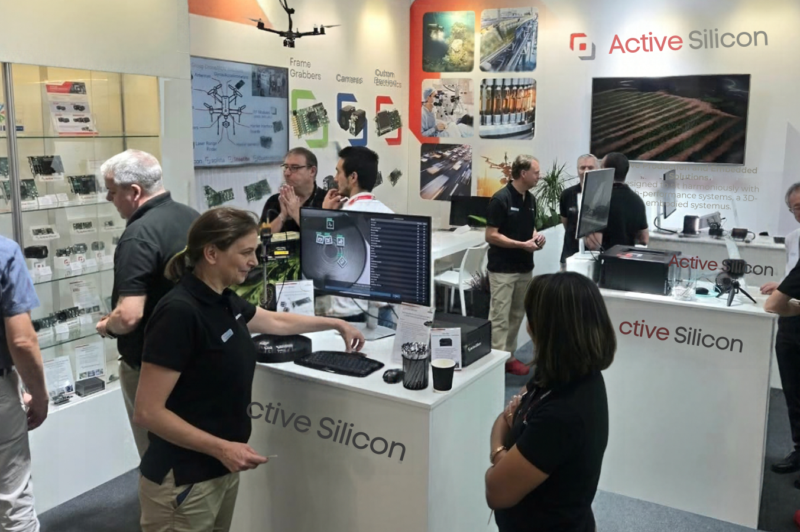 people at a machine vision show on the Active Silicon booth