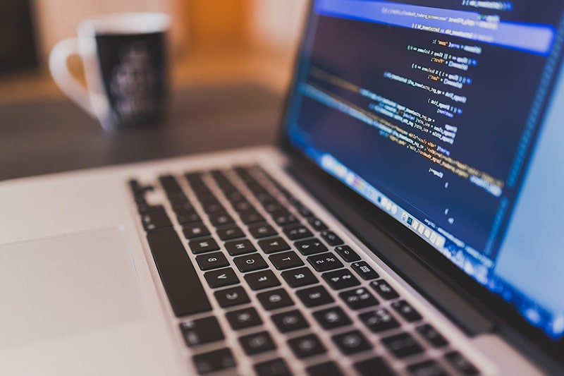 Laptop displaying software code