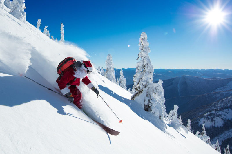 Santa skiing in winter landscape