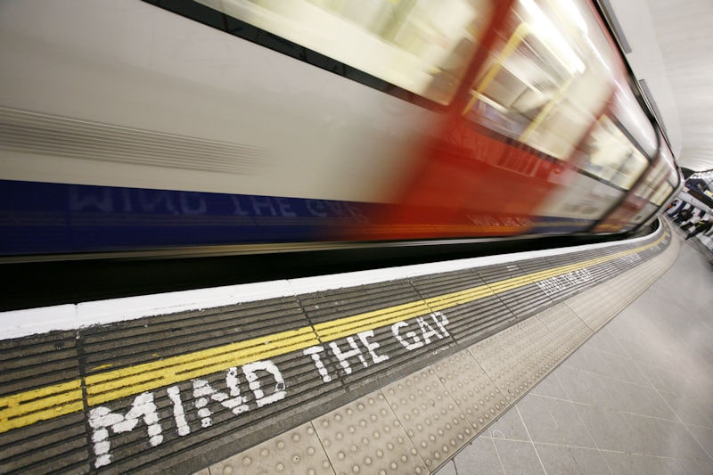 London underground train moving very fast past the platform