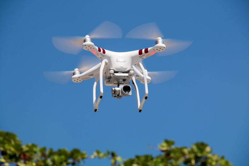 UAV Drone with an autofocus-zoom camera in flight