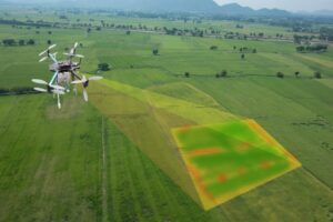 A drone projecting a CGI hyperspectral image onto a field below