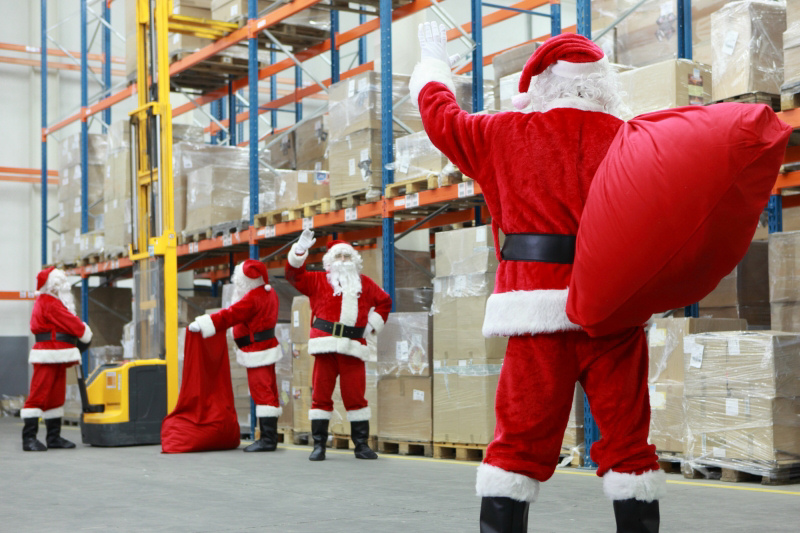 Santas working in a warehouse