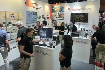 people at a machine vision show on the Active Silicon booth
